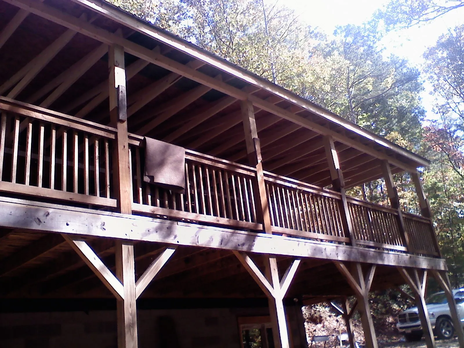 Timber framing under a new elevated porch and deck — Roof Leak Repair in Perrinton by Roofing Brothers